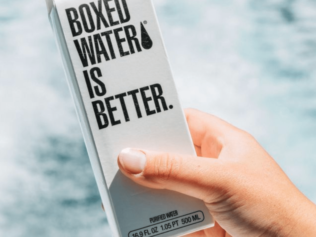 a hand holding a sign